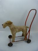 Vintage child's stuffed dog, baby walker on wheels