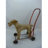 Vintage child's stuffed dog, baby walker on wheels