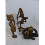 A carved African/Indonesian figure of two stick men, a carved figure of an Elephant on pedestal foot