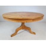 Large pine circular dining table on pedestal base