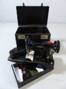 Folding portable Singer 221K sewing machine, in it's case and with electric lead and instruction