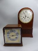 Pair of mantle clocks with keys and pendulums the largest with workings by Imperial