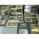 Four Albums of postcards (trains, ships, etc) and a book of vintage black & White pictures of