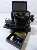 Folding portable Singer 221K sewing machine, in it's case and with electric lead and instruction