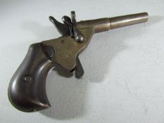 A vintage small calibre blank fire pistol, RGM marks rimfire