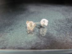 Pair of white gold diamond stud earrings of 1.1ct's