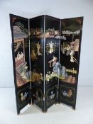 Oriental black-lacquered four fold screen depicting scenes of women