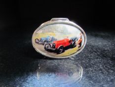 Silver pill box with enamel set lid depicting a vintage car