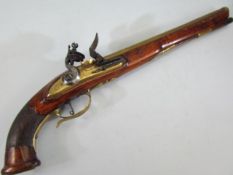 Flintlock long barrelled pistol with carved chequered grip unusual brass barrel (approx 32cm) with