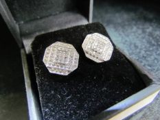 Pair of 14ct white gold pave set earrings of 1.2ct's approx