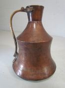 Unusual copper and brass shaped jug with large bulbous base.