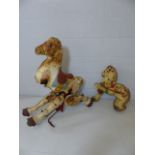 Two tin fairground style horses one with mechanical movement