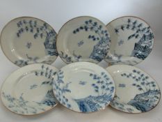 Six oriental hand-painted blue and white plates depicting herons and bamboo