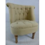 Cream upholstered boudoir chair with limed oak legs