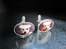 Pair of silver and enamel cufflinks with images of dog heads