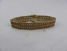Gold Bracelet 9ct three coloured Gold with circular links marked ITALY. Approx 26.2g
