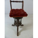 Victorian work stool with adjustable corkscrew seat on ornately carved base