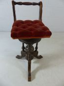 Victorian work stool with adjustable corkscrew seat on ornately carved base