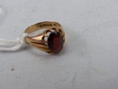 9ct Gold hallmarked Chester 1916 Gents claw set Garnet ring (total weight approx 5g)