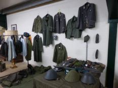 Large collection of military-style uniforms and accessories