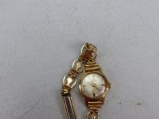 9ct Gold Hallmarked cased ladies watch by Hamilton on a Gold Coloured metal starp