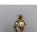 9ct Gold Hallmarked cased ladies watch by Hamilton on a Gold Coloured metal starp
