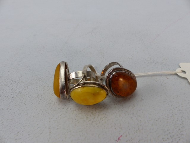 Three Silver rings Set with Amber & Butterscotch Amber