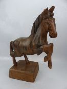 Carved wooden figure of a rearing horse. Possibly carved in fruitwood.
