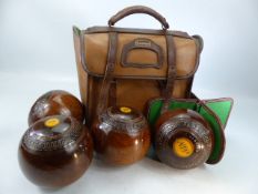A set four vintage Slazenger lawn bowls in carrying bag