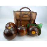 A set four vintage Slazenger lawn bowls in carrying bag