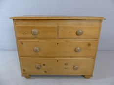 Small low pine Chest of drawers with two large drawers and two small