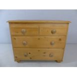 Small low pine Chest of drawers with two large drawers and two small