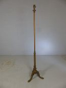 Brass and copper lamp stand on tripod serpent feet