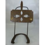 Brass and iron arts and crafts style book stand on horseshoe base