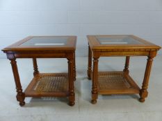 Pair of modern side tables with glass tops and rush shelves