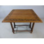 Stripped oak drop leaf table with poker work design