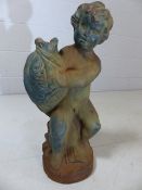 Cast iron figurine of a cherub clutching a fish