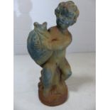 Cast iron figurine of a cherub clutching a fish