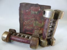 Pair of vintage SANDOWS hand grip exercise dumbbells in original tin box