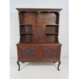 Greenman oak dresser with typical Greenman head to doors.