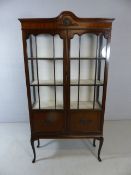 Glass fronted display cabinet on legs with key and two shelves by J & B Blower Ltd of Shewsbury