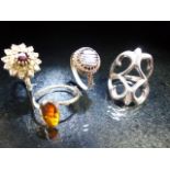Collection of four rings one set with Amber