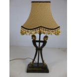 Three-stemmed occasional lamp with brass horse head finials and brass hoofed feet on marble plinth