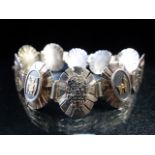 Silver 925 bracelet with sunburst panels with alternate gold & Silver coloured emblems