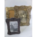 Two Silver coloured ornate photo frames and one small hallmarked Silver photo frame