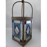 Brass lantern with four stained glass panels