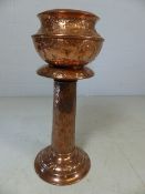 Copper jardiniere and stand in the arts and crafts style. Approx height 73cm