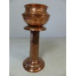 Copper jardiniere and stand in the arts and crafts style. Approx height 73cm