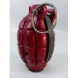 A WWII Mills No.36 hand grenade - demo/practice model with original pin