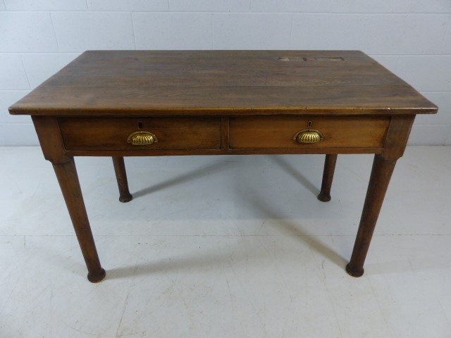 Original Teachers desk with Brass plated ink wells and brass shell handles to two drawers